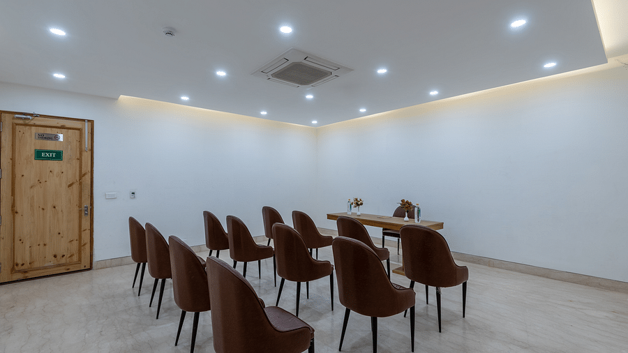 Back view of a conference room with chairs neatly arranged for a meeting or event at DLS The Classio